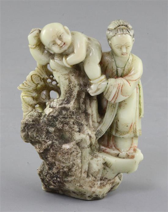 A Chinese export polychrome soapstone group of a mother and child, probably 18th century, height 11.5cm
